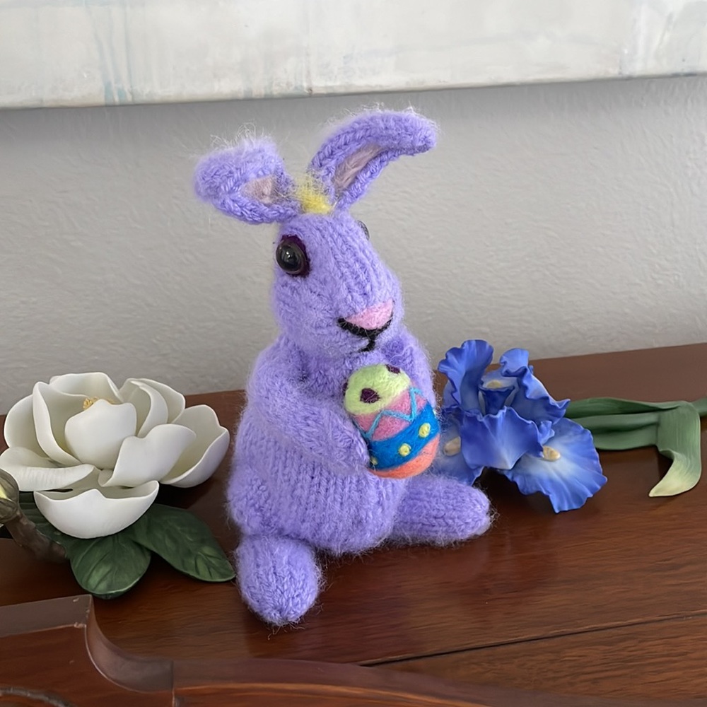 Handcrafted knit and needle felted bunny rabbit holding felted egg